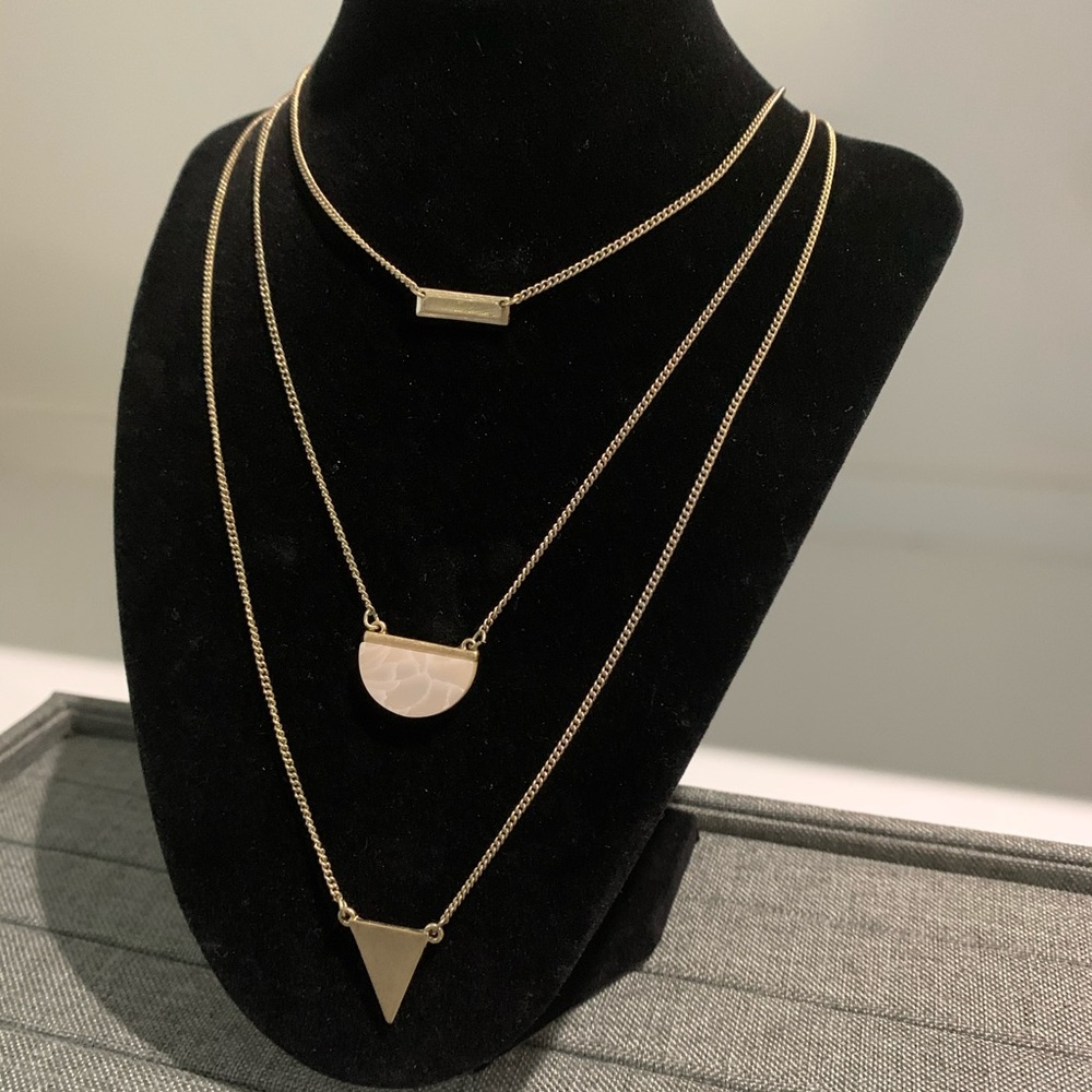 Three chain necklace with marble like pendant